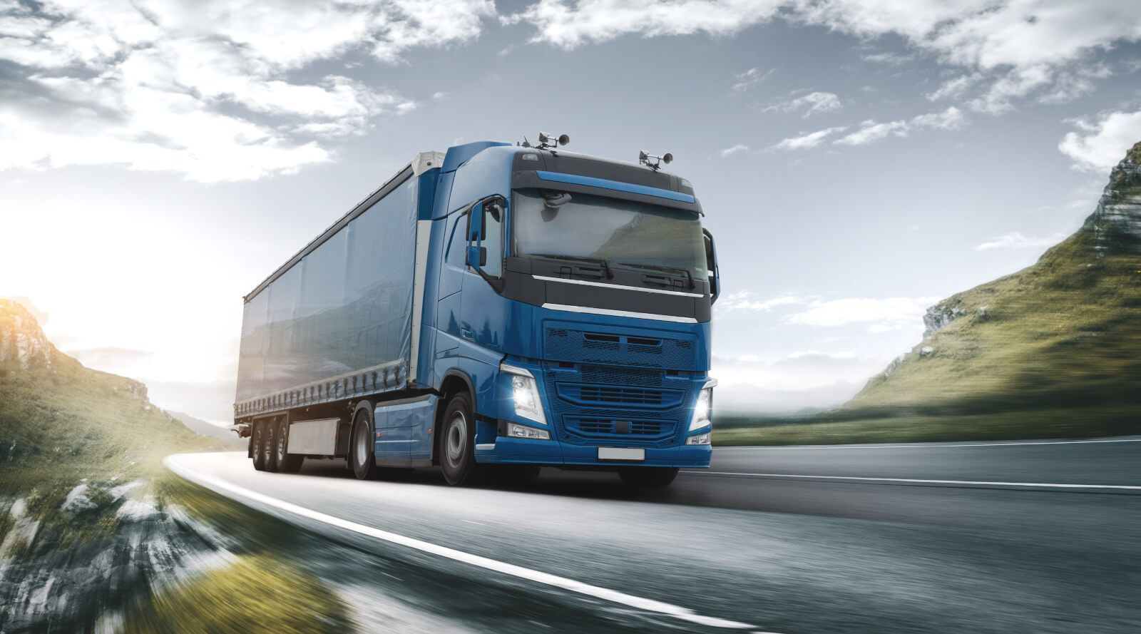 blue hgv on the road