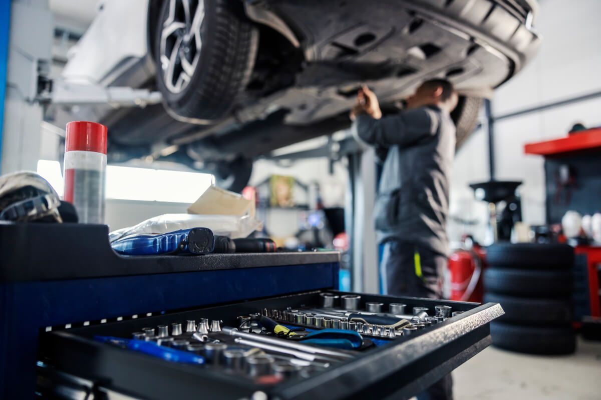 mechanic working under a car