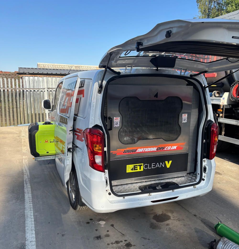 van outside with boot and doors open