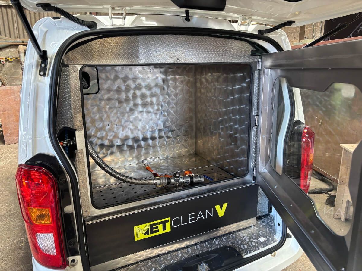 Mobile DPF cleaning machine open in van