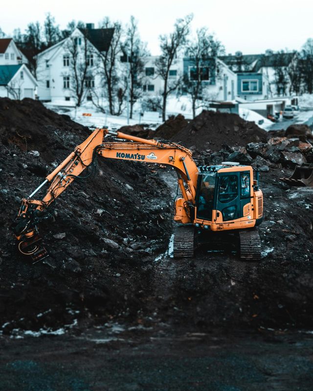 Excavator digging mud
