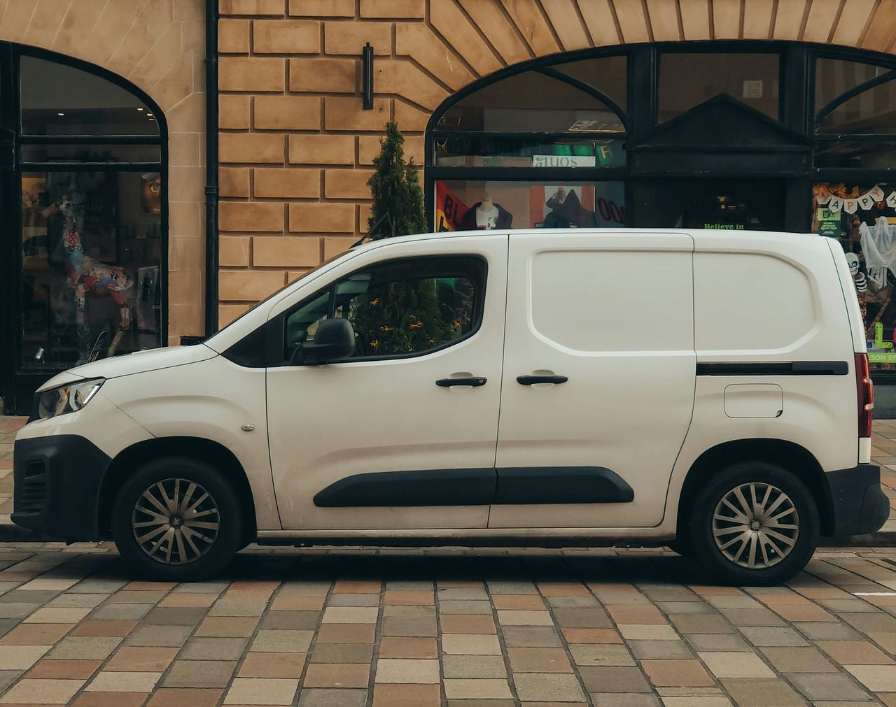 White van in street